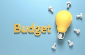 the word budget with a lightbulb
